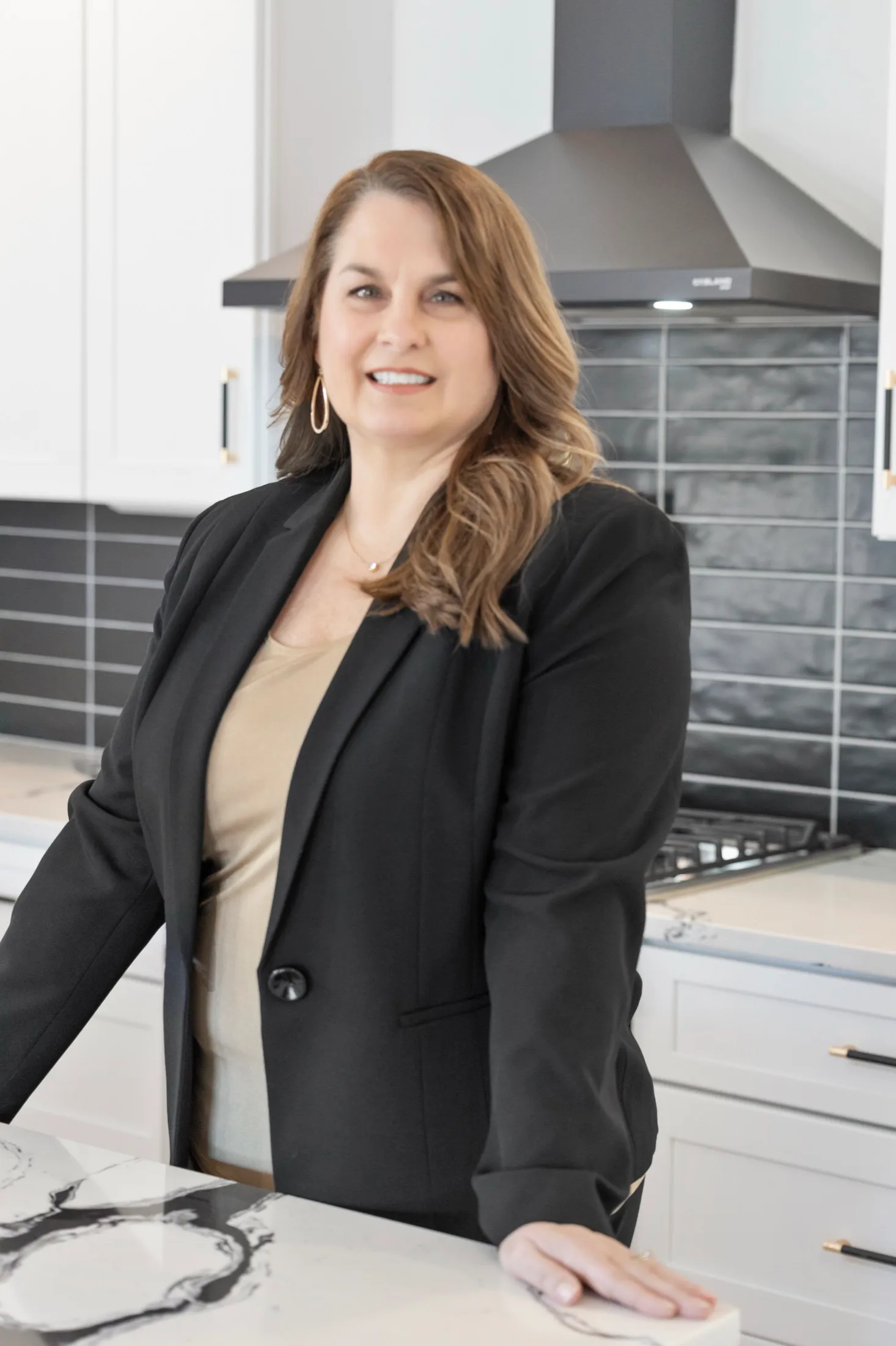 Nyla Hucks in the kitchen of a Hucks Homes build